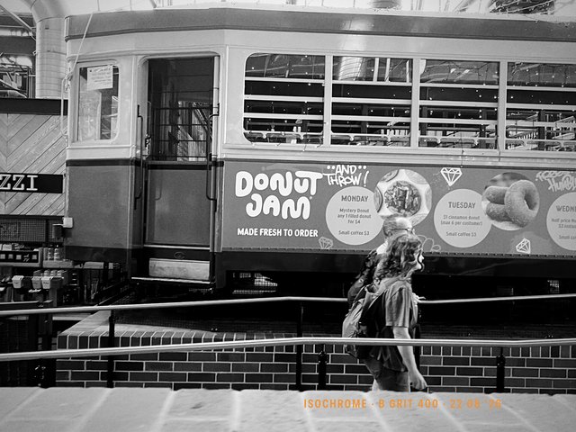 A tram in the sheds, advertising still on its flank. Made with Isochrome, B Grit 400.